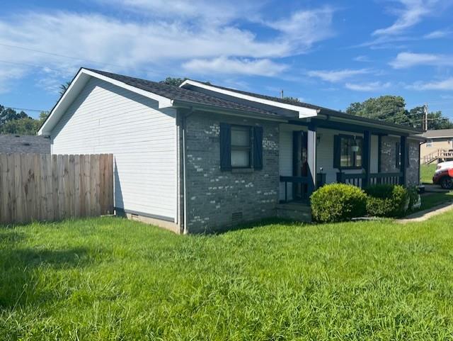 46 Red Cedar Blvd, Poplar Bluff, MO 63901 - view of property exterior featuring crawl space, brick siding, and a porch