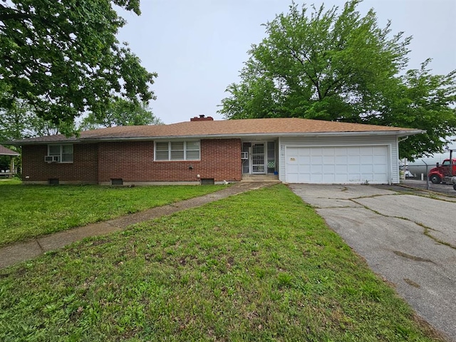 ranch-style house featuring driveway, a garage, brick siding, a front yard, and a chimney