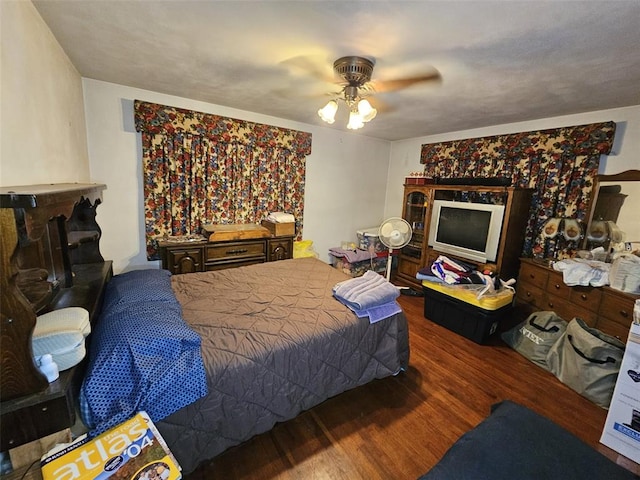 bedroom with wood finished floors and a ceiling fan