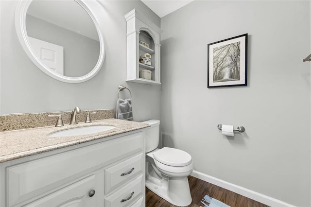 13645 Mason Oaks Dr, Missouri River Township, MO 63131 - bathroom featuring toilet, vanity, wood finished floors, and baseboards
