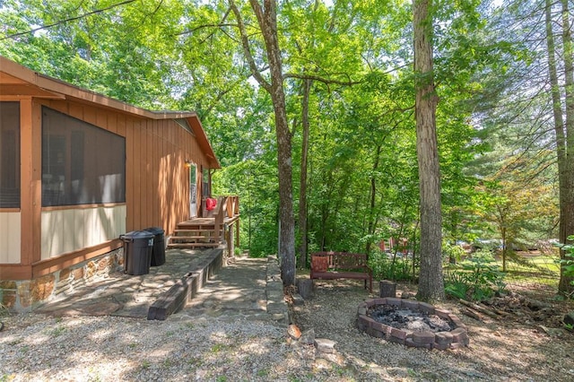 view of yard with an outdoor fire pit