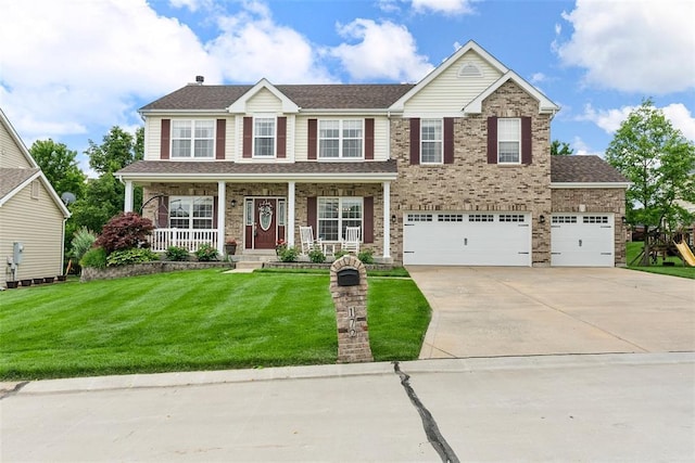 172 Snake River Dr, Dardenne Prairie, MO 63368 - view of front of home featuring concrete driveway, a front lawn, a porch, an attached garage, and a shingled roof