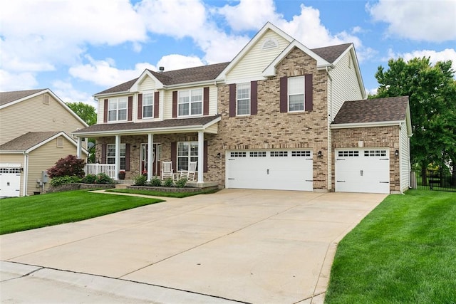 172 Snake River Dr, Dardenne Prairie, MO 63368 - view of front of home featuring a porch, driveway, a garage, and brick siding
