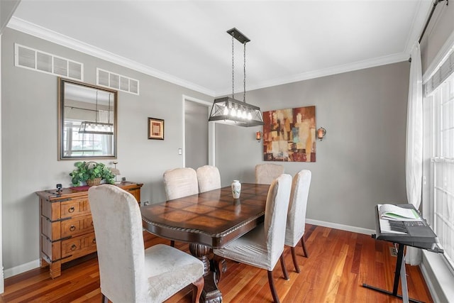 172 Snake River Dr, Dardenne Prairie, MO 63368 - dining space with wood finished floors, ornamental molding, and baseboards