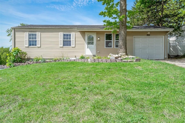 ranch-style house featuring a garage, a front yard, and driveway