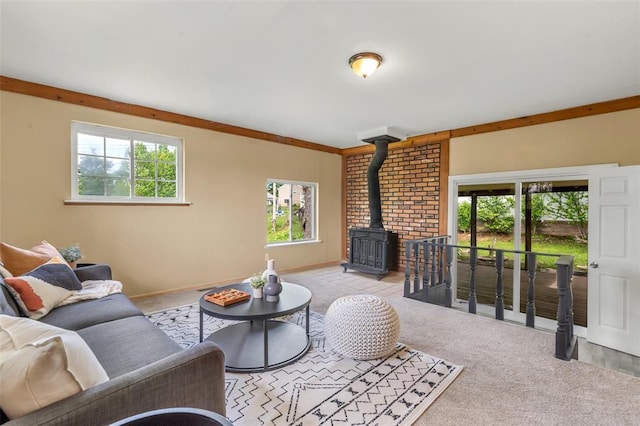 carpeted living area featuring a wood stove