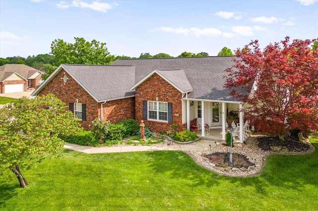 1 Pin Oak Ct, Maryville, IL 62062 - view of front of house with a front yard, brick siding, and roof with shingles