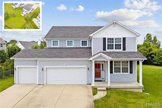 508 Frost Ct, Ofallon, IL 62269 - traditional home featuring driveway, covered porch, roof with shingles, and a garage