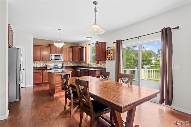508 Frost Ct, Ofallon, IL 62269 - dining space featuring dark wood-style floors and baseboards