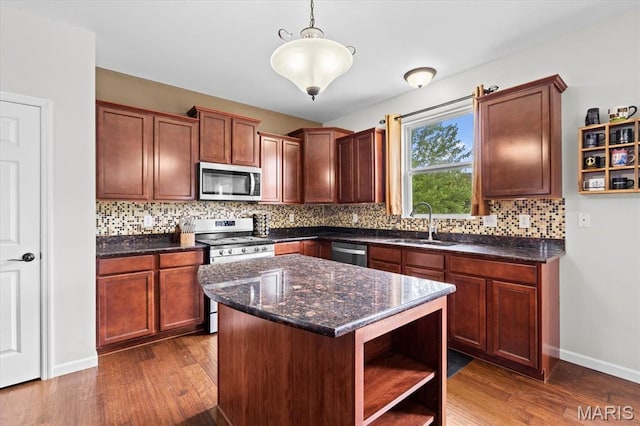 508 Frost Ct, Ofallon, IL 62269 - kitchen with stainless steel appliances, tasteful backsplash, dark wood finished floors, open shelves, and decorative light fixtures