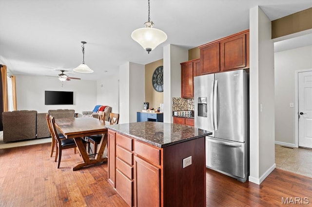 508 Frost Ct, Ofallon, IL 62269 - kitchen with stainless steel fridge with ice dispenser, a kitchen island, ceiling fan, hanging light fixtures, and dark wood-style floors