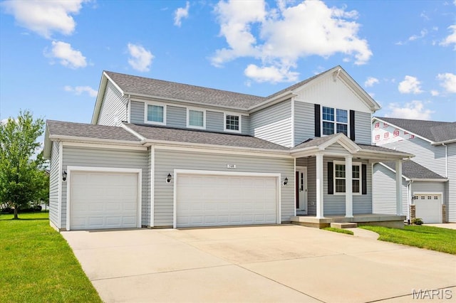 508 Frost Ct, Ofallon, IL 62269 - view of front facade with driveway, a porch, an attached garage, a front lawn, and roof with shingles