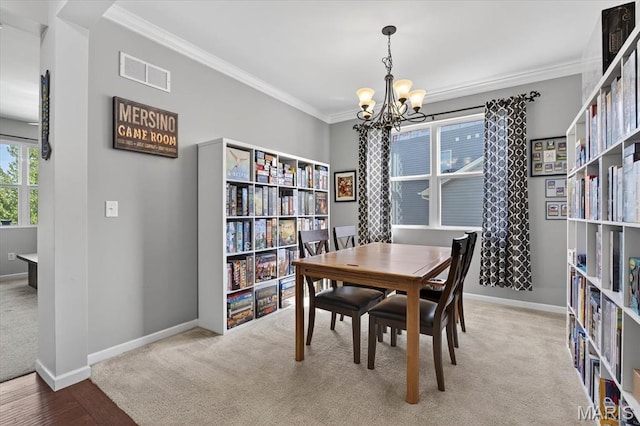 508 Frost Ct, Ofallon, IL 62269 - dining space with a chandelier, crown molding, and carpet