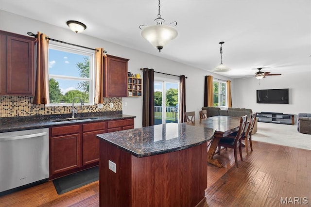 508 Frost Ct, Ofallon, IL 62269 - kitchen featuring stainless steel dishwasher, dark wood-style flooring, open floor plan, and decorative light fixtures