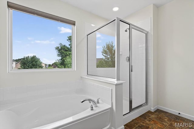508 Frost Ct, Ofallon, IL 62269 - bathroom featuring a garden tub, a stall shower, stone finish floors, and recessed lighting