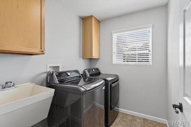 508 Frost Ct, Ofallon, IL 62269 - washroom featuring washer and dryer, cabinet space, and light tile patterned floors
