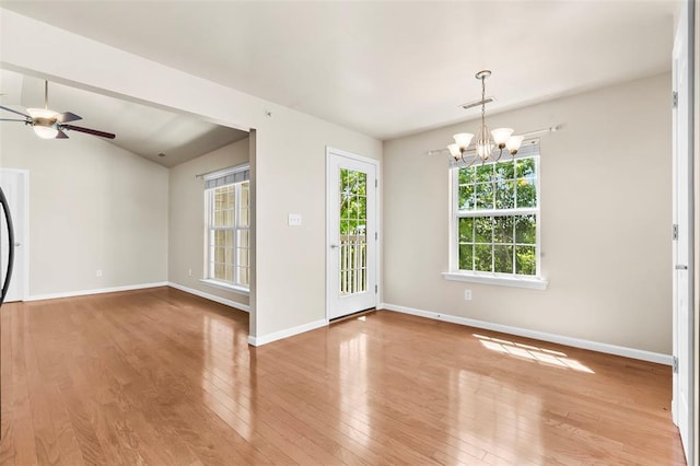 1131 Welsh Dr, Lake St Louis, MO 63367 - spare room featuring a chandelier, wood finished floors, baseboards, and ceiling fan