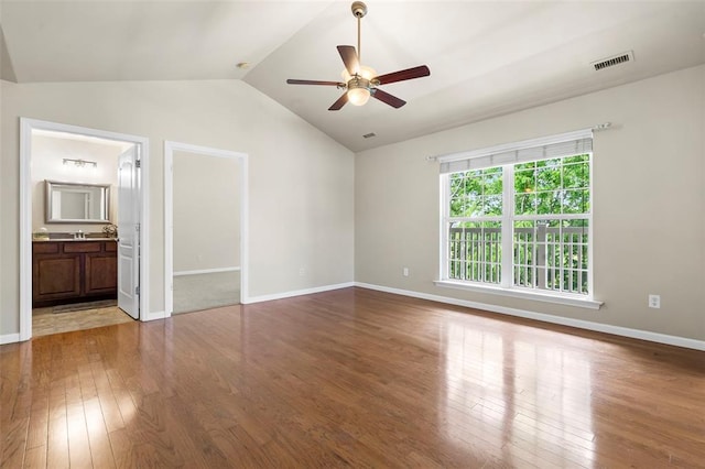 1131 Welsh Dr, Lake St Louis, MO 63367 - unfurnished bedroom with lofted ceiling, hardwood / wood-style floors, baseboards, a walk in closet, and ceiling fan