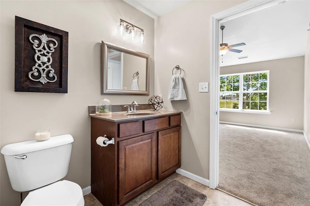 1131 Welsh Dr, Lake St Louis, MO 63367 - half bathroom with toilet, vanity, ceiling fan, and baseboards