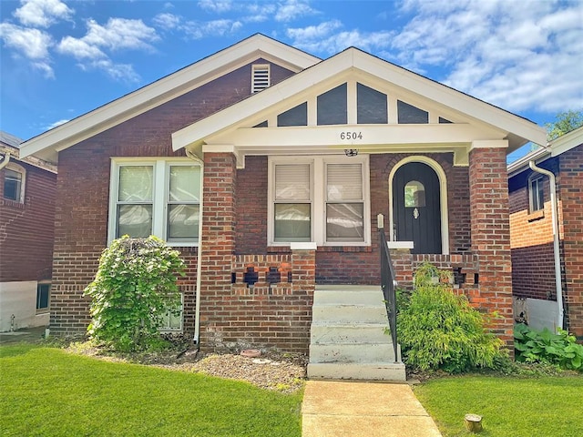 6504 Hoffman Ave, Saint Louis, MO 63139 - view of front of house with a front yard and brick siding