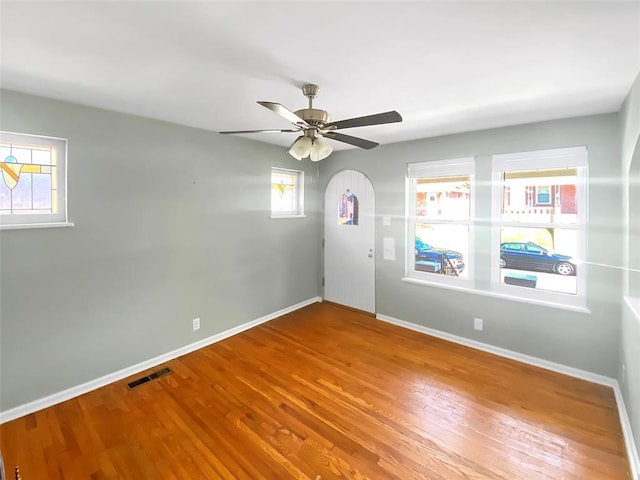 6504 Hoffman Ave, Saint Louis, MO 63139 - empty room featuring plenty of natural light, baseboards, and wood finished floors