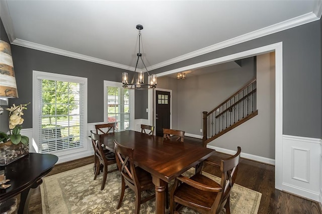 1026 Barry Ct, Kirkwood, MO 63122 - dining room with a chandelier, ornamental molding, a wainscoted wall, wood finished floors, and stairs