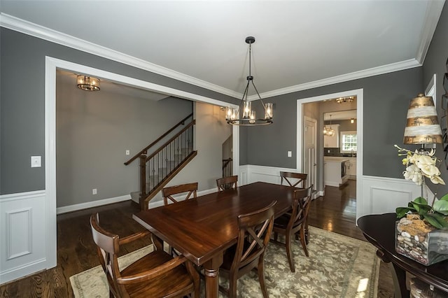 1026 Barry Ct, Kirkwood, MO 63122 - dining room featuring a chandelier, wood finished floors, ornamental molding, wainscoting, and stairway