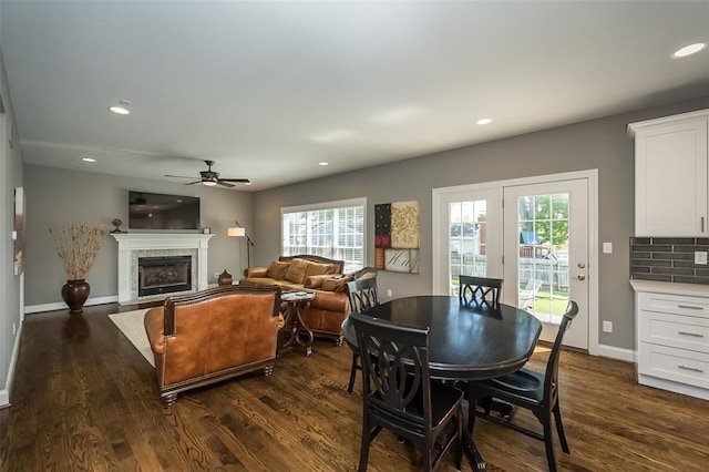 1026 Barry Ct, Kirkwood, MO 63122 - dining area with ceiling fan, dark wood-style floors, recessed lighting, baseboards, and a fireplace
