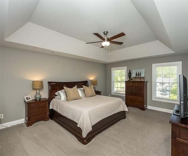 1026 Barry Ct, Kirkwood, MO 63122 - carpeted bedroom featuring a raised ceiling, baseboards, and a ceiling fan