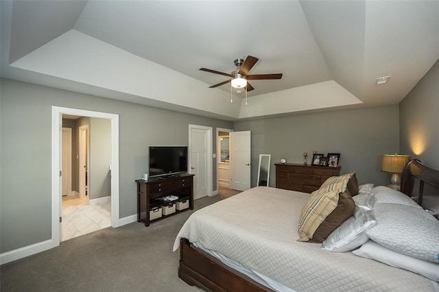 1026 Barry Ct, Kirkwood, MO 63122 - bedroom featuring carpet flooring, a tray ceiling, baseboards, and a ceiling fan