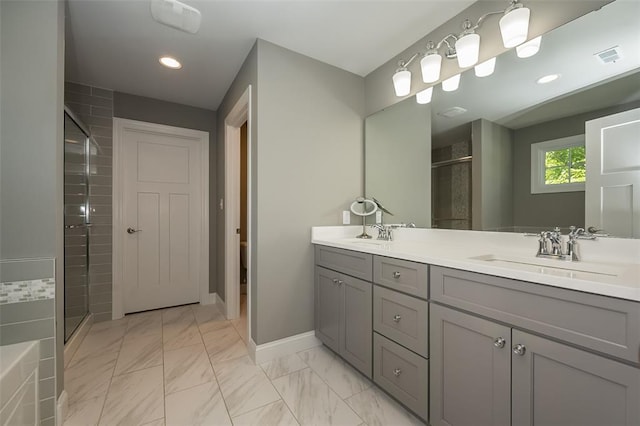 1026 Barry Ct, Kirkwood, MO 63122 - full bath featuring a stall shower, double vanity, baseboards, recessed lighting, and marble finish flooring