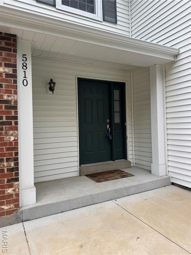 5810 White Pine Dr, Saint Louis, MO 63129 - property entrance with brick siding