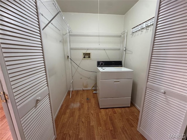5810 White Pine Dr, Saint Louis, MO 63129 - washroom with washer / dryer and wood finished floors