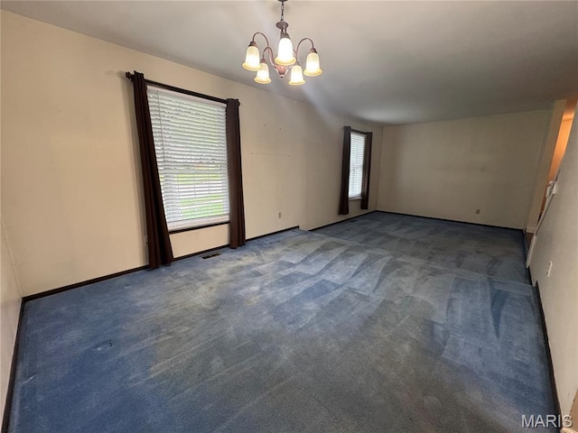 5810 White Pine Dr, Saint Louis, MO 63129 - unfurnished room featuring a chandelier, carpet flooring, and healthy amount of natural light