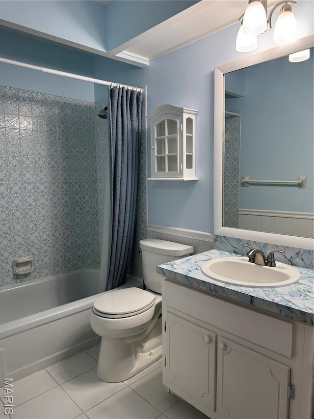 5810 White Pine Dr, Saint Louis, MO 63129 - full bathroom featuring tile patterned floors, vanity, shower / bathtub combination with curtain, and a wainscoted wall