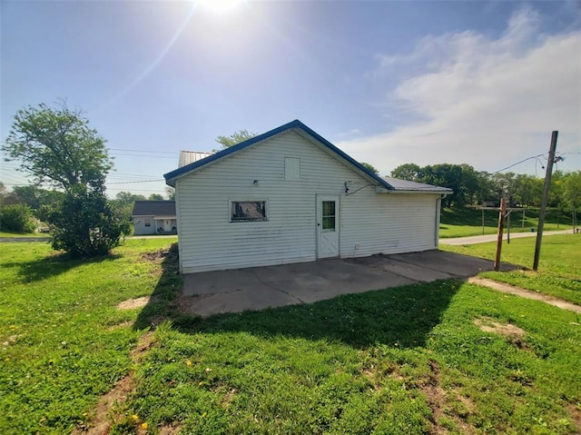 517 N 4th St, La Grange, MO 63448 - view of property exterior featuring a patio and a lawn