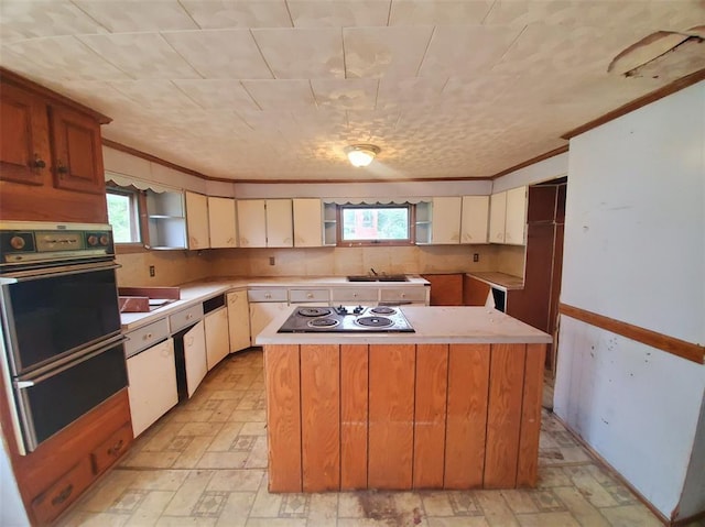 517 N 4th St, La Grange, MO 63448 - kitchen featuring wall oven, electric stovetop, a sink, a center island, and healthy amount of natural light