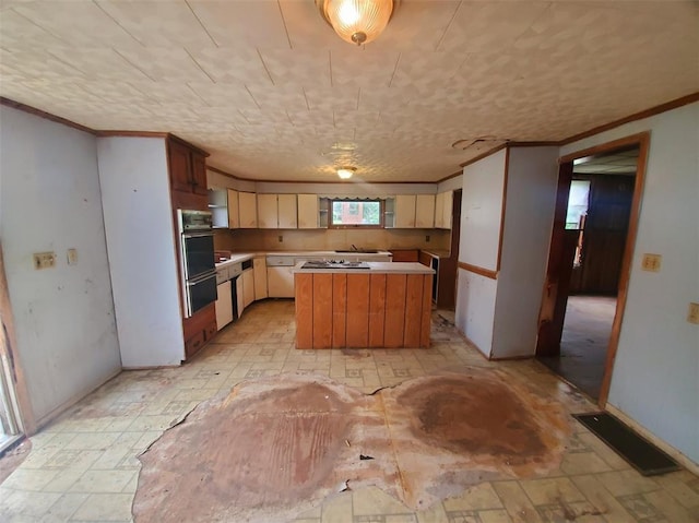 517 N 4th St, La Grange, MO 63448 - kitchen featuring a center island, ornamental molding, light countertops, a warming drawer, and cooktop