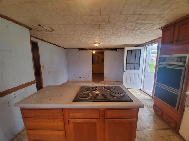 517 N 4th St, La Grange, MO 63448 - kitchen with black electric stovetop and light countertops