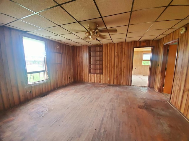 517 N 4th St, La Grange, MO 63448 - spare room featuring hardwood / wood-style flooring, wood walls, and a paneled ceiling