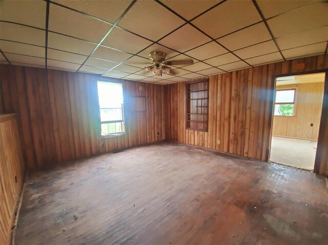 517 N 4th St, La Grange, MO 63448 - unfurnished room with wood finished floors, a drop ceiling, and wooden walls