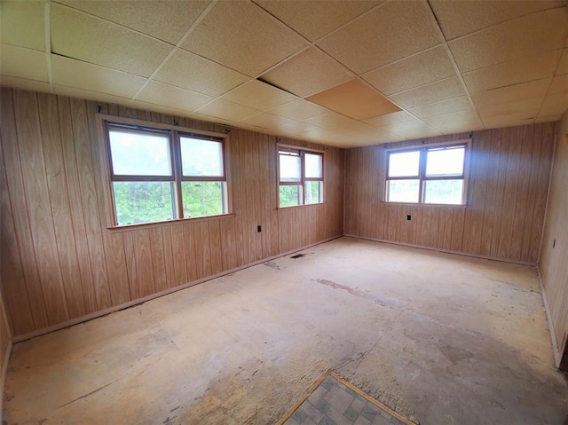 517 N 4th St, La Grange, MO 63448 - empty room featuring a drop ceiling and wood walls