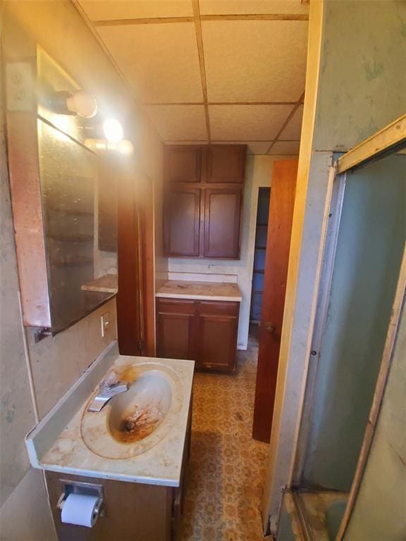 517 N 4th St, La Grange, MO 63448 - bathroom featuring tile patterned floors, vanity, an enclosed shower, and a drop ceiling