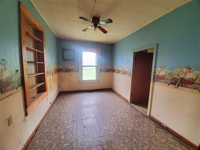 517 N 4th St, La Grange, MO 63448 - empty room featuring ceiling fan, baseboards, and wainscoting