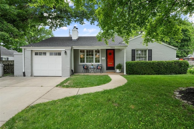 view of front of home with an attached garage, brick siding, driveway, a chimney, and a porch