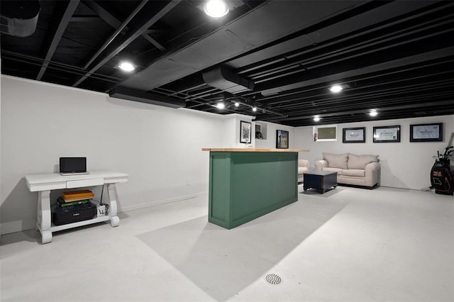 finished basement featuring a bar