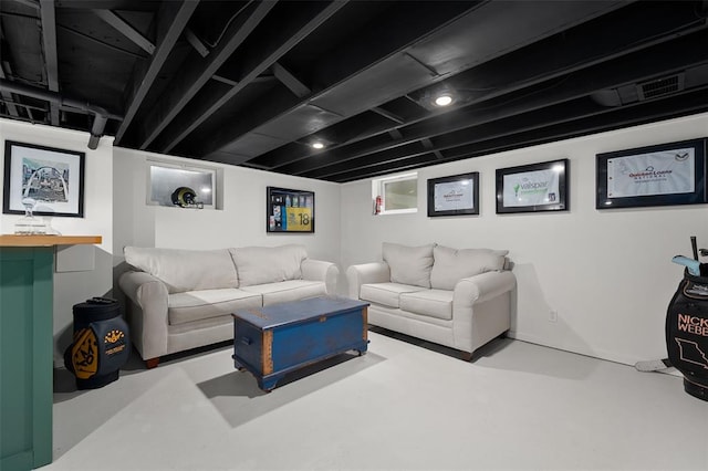 living area with finished concrete flooring
