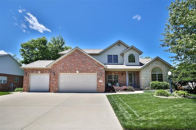 3355 Garvey Ln, Edwardsville, IL 62025 - traditional-style home featuring a garage, a front yard, driveway, brick siding, and roof with shingles
