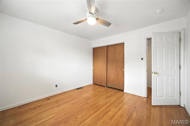 2649 Georgia Dr, Arnold, MO 63010 - unfurnished bedroom featuring a closet, light wood-style floors, and a ceiling fan