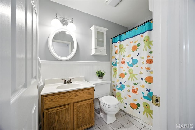 2649 Georgia Dr, Arnold, MO 63010 - bathroom featuring wainscoting, vanity, tile patterned floors, and a shower with curtain